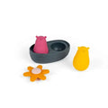 Gray bath toy boat with pink and yellow bear figures and an orange flower-shaped toy on a white background.