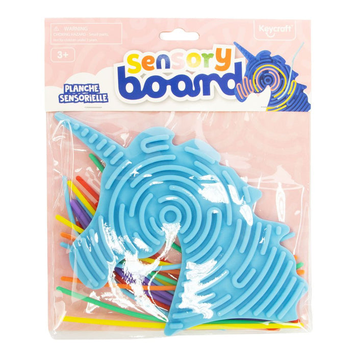 Blue unicorn-shaped silicone board with circular grooves and colorful strings in pink and white retail packaging.