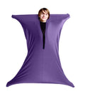 Child inside a purple stretchy body sock, stretching their arms and legs to form a four-pointed star shape.