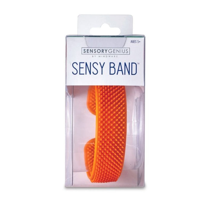 Bright orange silicone slap bracelet with small tactile bristles, shown in clear retail packaging.