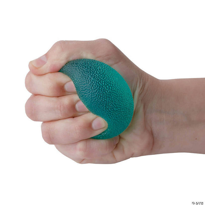 Hand squeezing a translucent teal egg-shaped stress ball with a bumpy, pebbled texture against a white background.