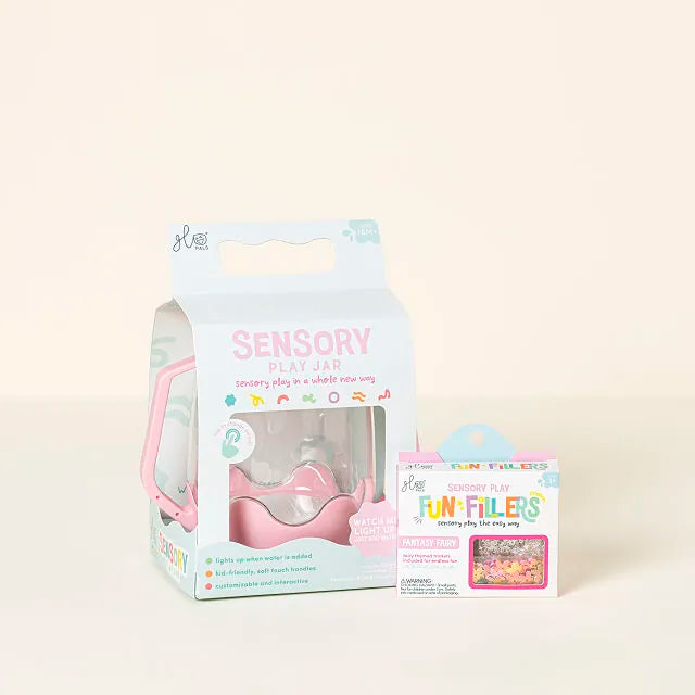 Pink Glo Pals sensory play jar in white packaging next to a small box of colorful Fun Fillers.