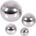 Four shiny silver spheres in varying sizes with highly reflective mirror-like surfaces against a white background.