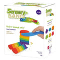 White box showing rainbow-layered sand being sliced by a blue toy knife. Net weight 5kg and multi-colored sand piles shown.