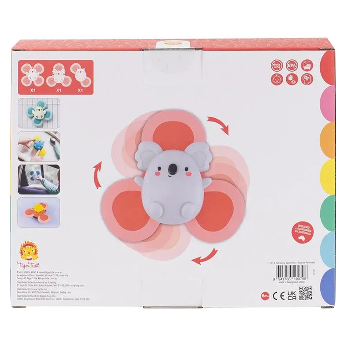 Back of toy box showing a pink koala sensory spinner, motion arrows, and photos of animal-themed suction toys in use.
