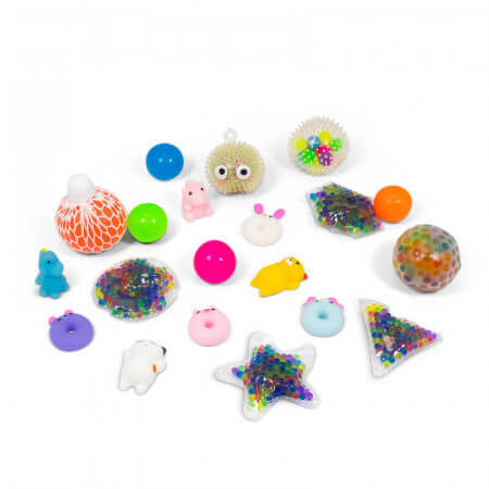 Variety of colorful sensory toys including squishy animals, mesh balls, and gel-filled shapes in various colors and sizes.