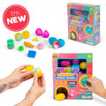 Toy vending machine box with colorful surprise eggs and small sensory fidget toys like squishies and a smiley spring.