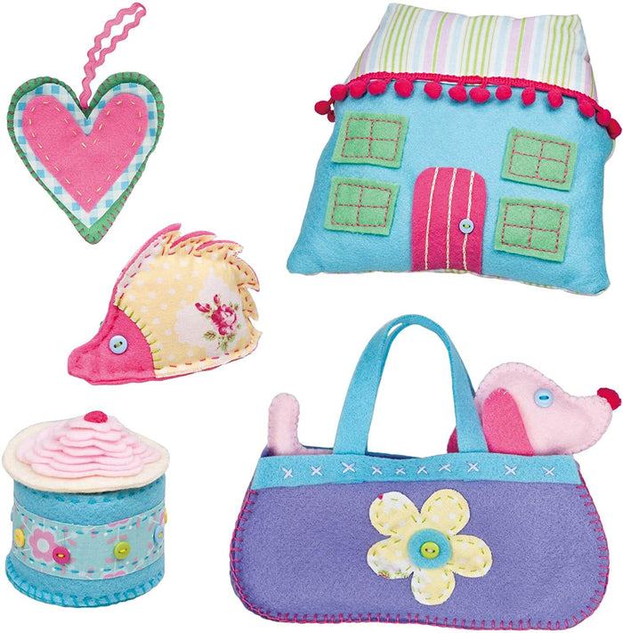 Hand-stitched felt crafts: pink heart, blue house, floral hedgehog, cupcake, and purple bag with a pink puppy.