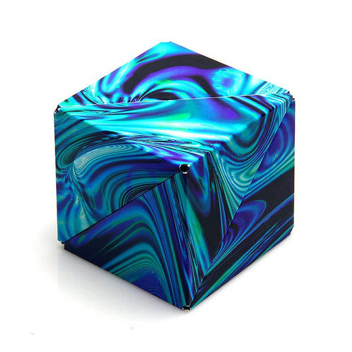 Geometric puzzle cube with a vibrant, swirling marble pattern in shades of teal, blue, and purple.