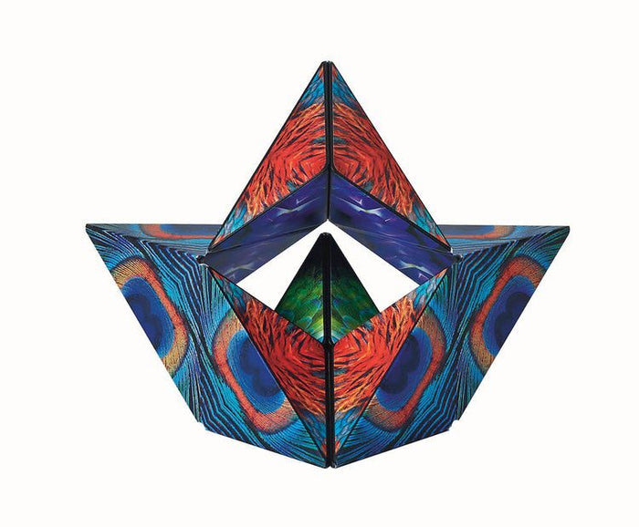 Geometric magnetic puzzle in a winged shape with a vibrant blue, orange, and green peacock feather pattern.