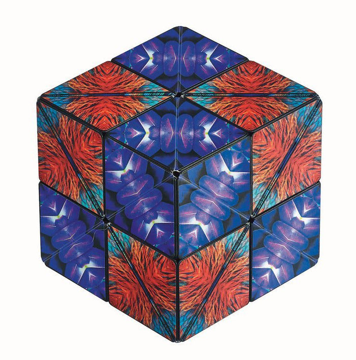 Cube puzzle with vibrant orange feather patterns and blue-purple kaleidoscope designs on its segmented surfaces.