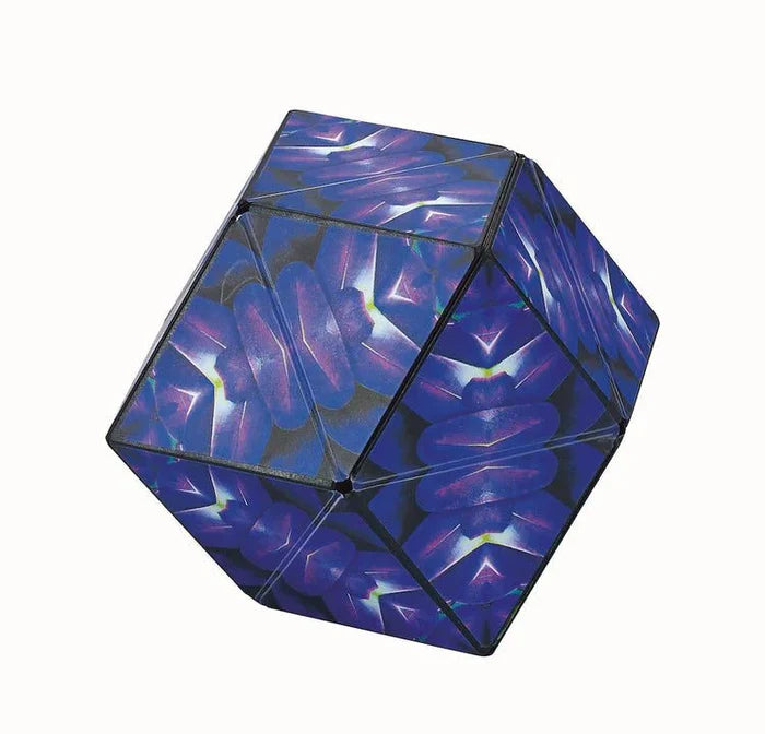 Geometric magnetic puzzle with dark blue and purple kaleidoscopic wing patterns on its multifaceted surfaces.