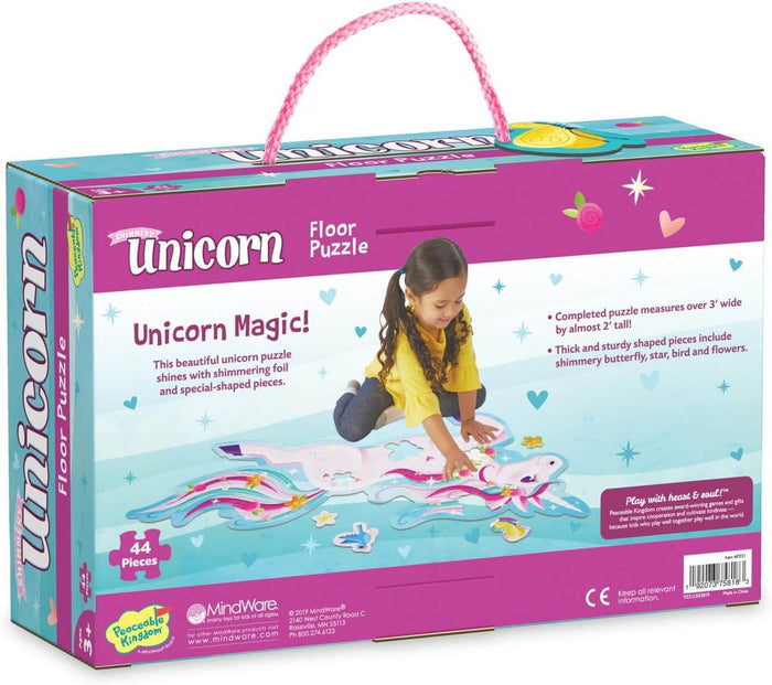 Pink and teal box with a rope handle showing a girl assembling a large unicorn-shaped puzzle on the floor.