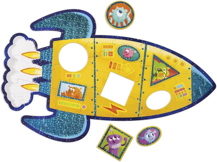 Yellow rocket puzzle with glittery blue fins, white exhaust, and shape-matching pieces featuring colorful aliens.