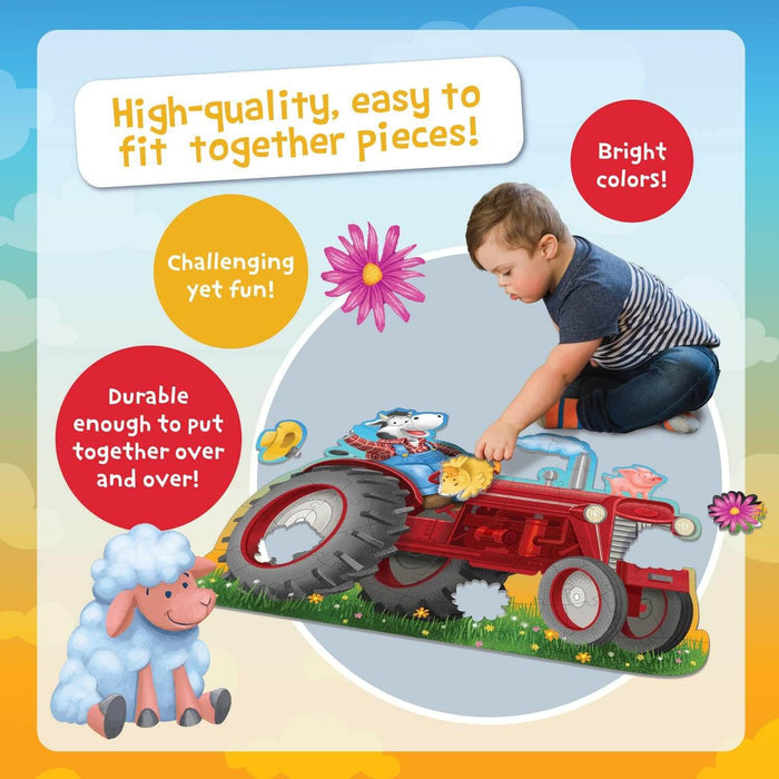 A boy builds a large red tractor floor puzzle with a sheep and pig, featuring colorful text bubbles about the pieces.