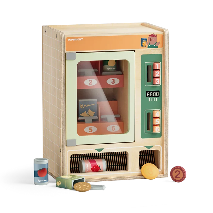 Wooden toy vending machine with orange and green panels, numbered buttons, toy food cans, and wooden coins.