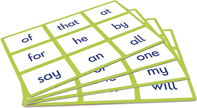 Three stacked green-bordered bingo cards with blue sight words like of, that, and at in a grid pattern.