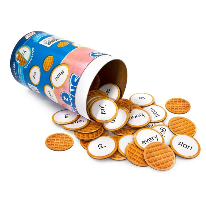 Blue and pink tube spilling round double-sided cards with a waffle pattern on one side and sight words on the other.
