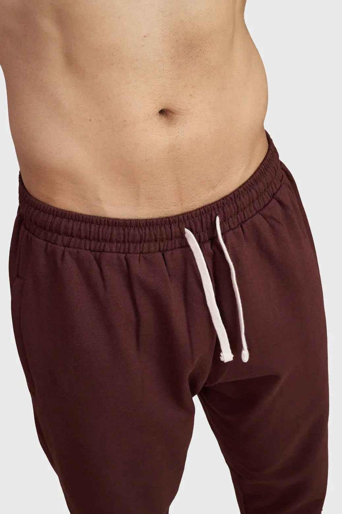 Fuaark Nz Signature Oversized Brown Joggers made of soft fabric, featuring a relaxed fit and casual style.