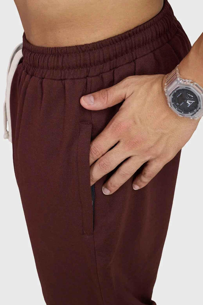 Fuaark Nz Signature Oversized Brown Joggers made of soft fabric, featuring a relaxed fit and casual style for comfort.