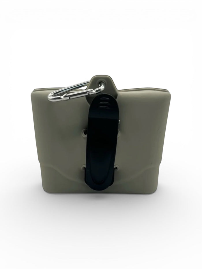 Silicone dog treat pouch by DogTreatNZ, showing a flexible, portable pet treat holder with a clip and snap closure.