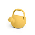 Yellow silicone toy watering can with a round body, short spout, and large curved handle.
