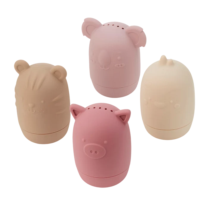 Four egg-shaped silicone bath toys in muted pink, tan, and cream shaped like a pig, koala, tiger, and chick.