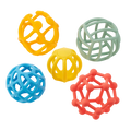 Five silicone balls with unique geometric cutout patterns in orange, green, blue, yellow, and coral red.
