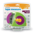 Toy tape measure with a green body, purple handle, and yellow winding crank inside clear retail packaging.