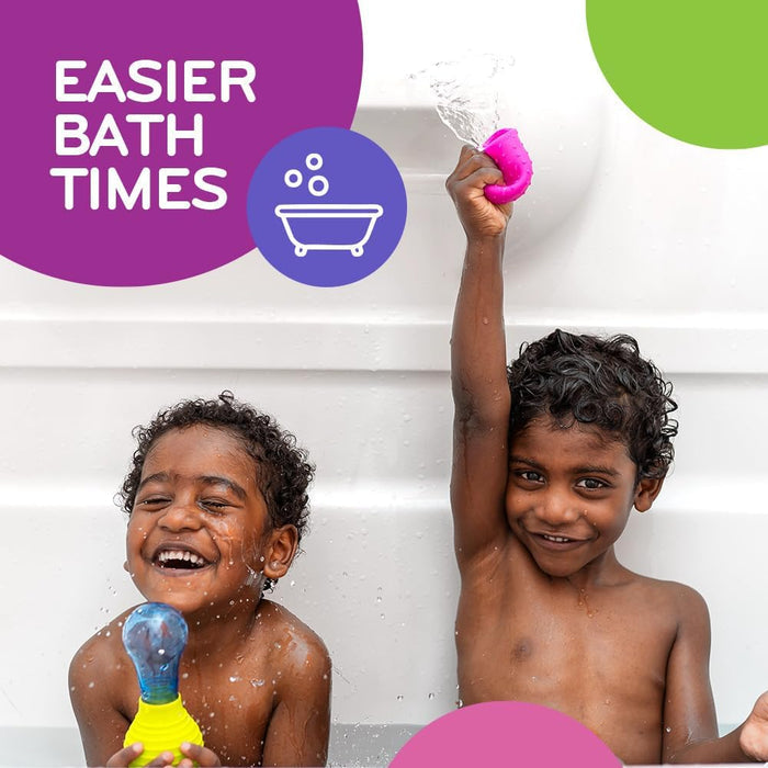 Two happy children in a bath playing with pink and blue water squeeze bulbs that splash and spray water.