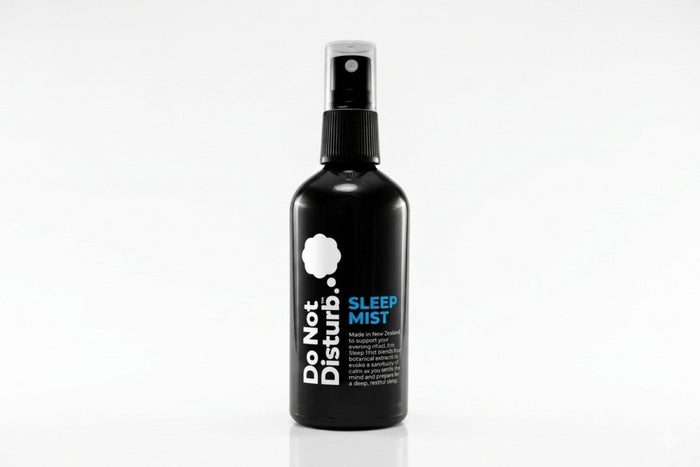Spray bottle of Do Not Disturb Sleep Company Sleep Mist with lavender and chamomile for relaxing bedtime aroma.
