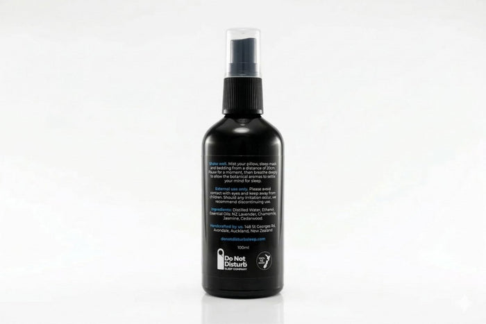 A bottle of Do Not Disturb Sleep Company Sleep Mist with a calming label, designed to promote restful sleep.