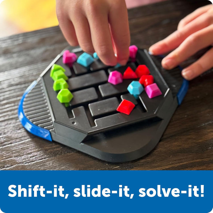 Hands moving colorful geometric pieces on a black hexagonal sliding puzzle board. Text: Shift-it, slide-it, solve-it!