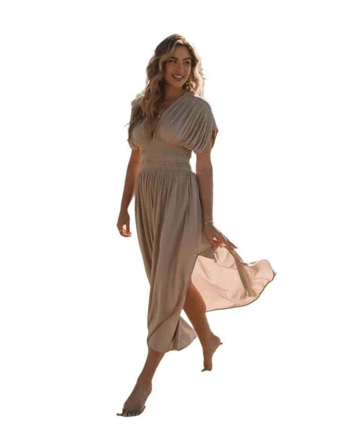 Stylish 3Sixty5 khaki summer dress with a slit, featuring a chic design and lightweight fabric for warm weather wear.