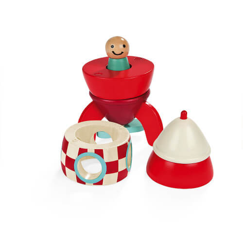 Four-piece magnetic wooden toy rocket in red and cream, featuring a smiling peg pilot and finned base.