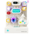 Science Can circuit toy with colorful modules, wires, digital displays, and a misting component on a white pegboard.