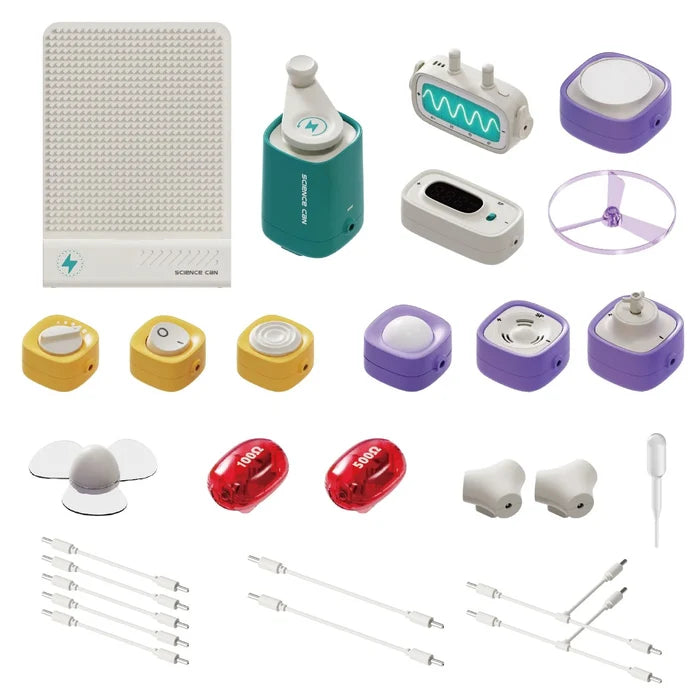Educational circuit toy with colorful modules, red resistors, white wires, and a teal hand-crank generator.