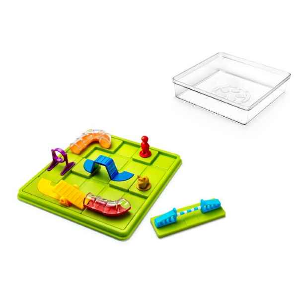 Green grid board with colorful plastic tunnels, jumps, a dog figurine, and a clear plastic storage lid.