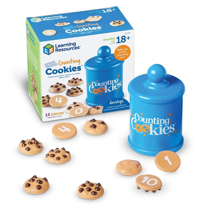 A blue toy cookie jar and numbered chocolate chip cookies shown in front of the green and blue product box.