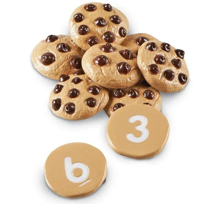 Tan toy cookies with dark brown chocolate chips and flat bottom sides showing white numbers 3 and 9.