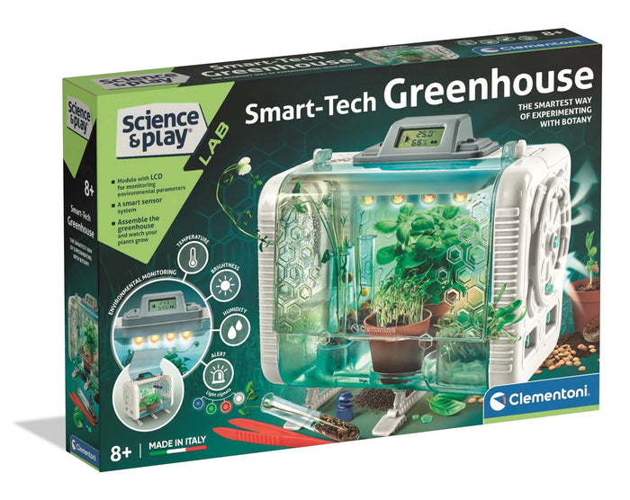 Box for a toy greenhouse featuring a white plastic enclosure with a digital monitor, lights, and plants inside.