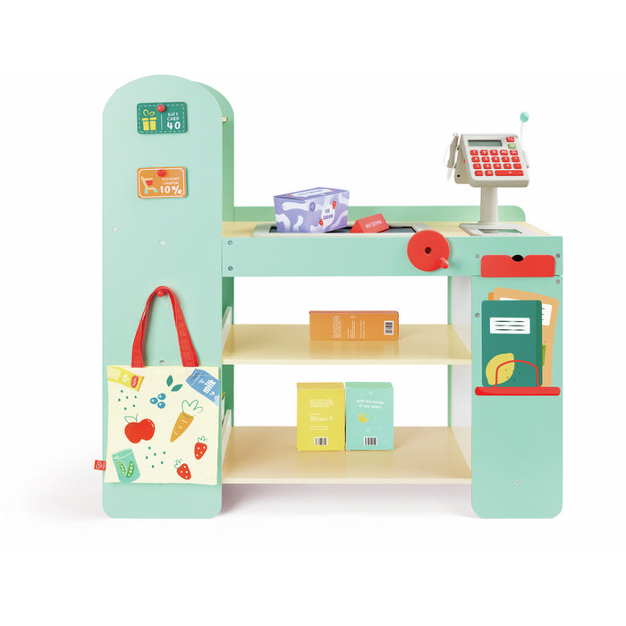 Mint green wooden toy supermarket with cash register, scanner, conveyor belt, and fruit-print shopping bag.