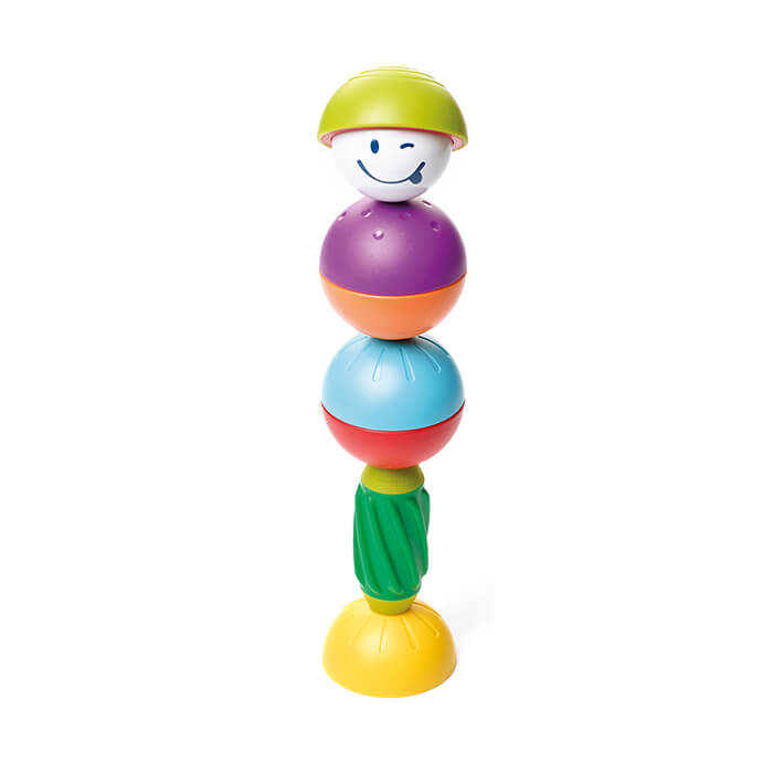 Stacked magnetic toy with a winking face, colorful textured spheres, a green spiral rod, and a yellow base.