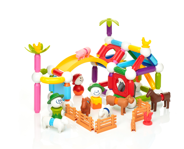 Colorful magnetic farm set with rods, balls, animal figures, and people characters on a white background.