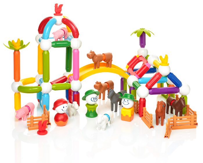 Colorful magnetic farm building set with animal figures, farmers, rods, and spheres in a large play scene on white.