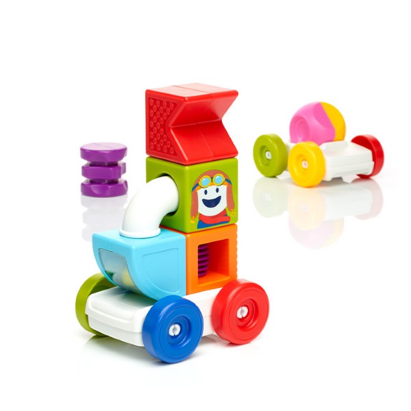 Colorful magnetic building blocks forming a tall vehicle with a smiling character face and a smaller car on wheels.