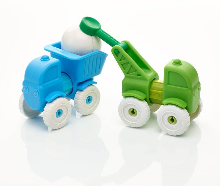 Blue dump truck and green crane toy with chunky white wheels. The crane lifts a white ball into the blue truck bed.