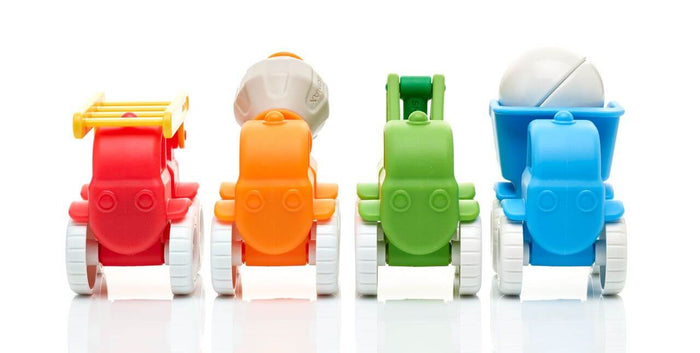 Four chunky toy trucks in red, orange, green, and blue with white wheels, a yellow ladder, and grey mixer drum.
