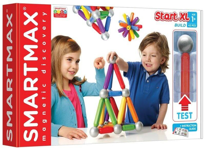 Red toy box shows a girl and boy building a pyramid structure with colorful magnetic bars and silver balls.