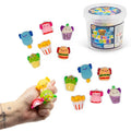 Twelve colorful mochi squishies shaped like axolotl snacks next to a tub, with a hand squeezing three toys.